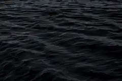 dark rippling water surface