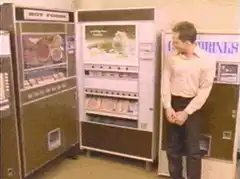 Man standing by vending machines