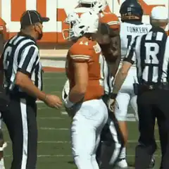 Referee touches Ehlinger's butt