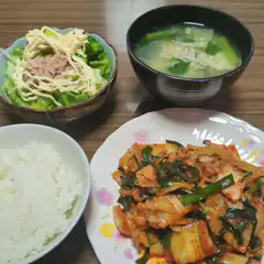 Japanese meal with kimchi, rice, salad, and soup
