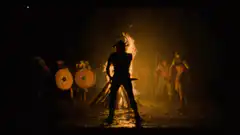 Viking warrior silhouette by fire
