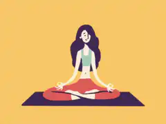 Woman meditating with floating hearts