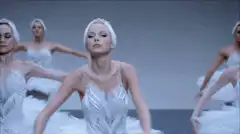 Ballerina soloist performs with corps de ballet
