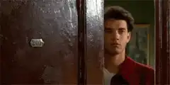 Tom Hanks peeking from behind door 207