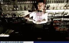 bartender flips drink into mouth