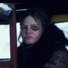 Woman picking her nose in a car