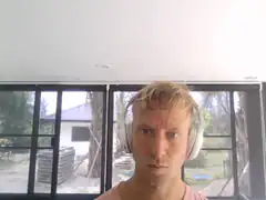 Man with headphones staring intensely