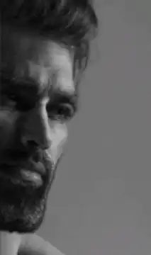 bearded man smiling then serious
