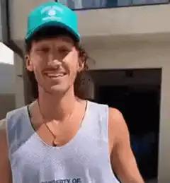 Guy in blue hat smiles then gives thumbs up