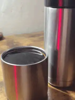 coffee cup with laser beam