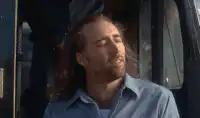 Nicolas Cage dissolving into space particles