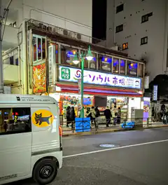 Seoul Market storefront at night with van