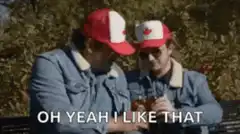 Two guys in Canadian hats drinking beer