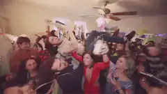 crowd surfing at a party