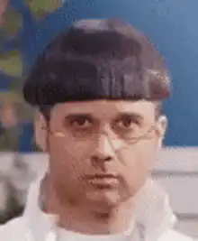 Man with bowl cut nodding
