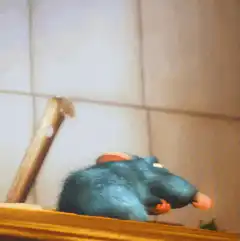 Rizzo the Rat eating a carrot