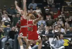 Dennis Rodman celebrating with arms raised