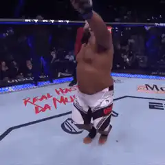 Derrick Lewis celebrates in the octagon