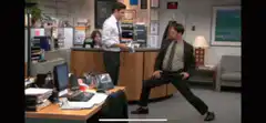 Jim sprays Dwight's hair