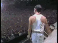 Freddie Mercury performing on stage