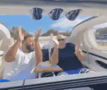 Two men dancing in a boat