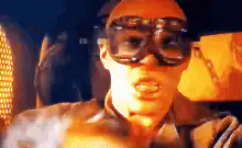 Man exhales glowing blue smoke
