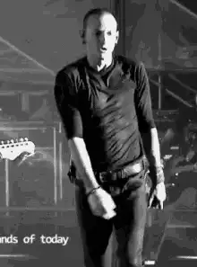 Chris Martin dancing on stage
