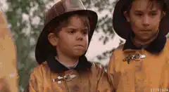 Two young boys in firefighter uniforms