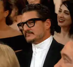Pedro Pascal adjusting his glasses