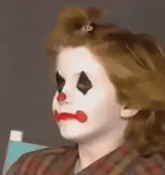 Clown makeup girl smiles