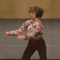 Woman in floral shirt dancing