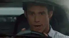 Jim Carrey driving a white Saleen S7