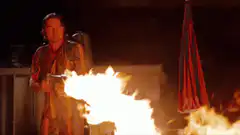 Elderly woman uses a flamethrower