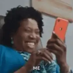 Woman laughing hysterically at phone
