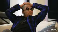 Snoop Dogg hands behind head