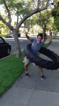 man spinning a large tire
