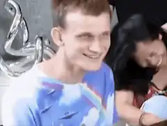 Man in tie-dye shirt smiling