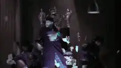 The Joker dancing with henchmen