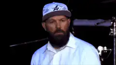 Bearded man in Atlanta Braves hat