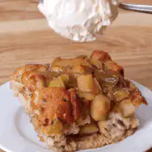 Scoop of ice cream on apple pie