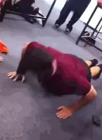 person doing pushups on floor