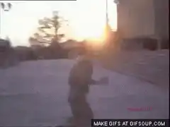 person doing a backflip in a plaza