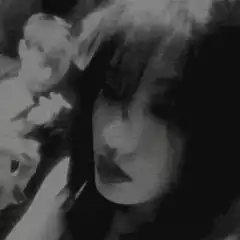 grainy black and white girl in car