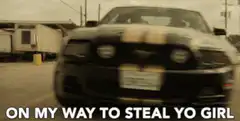 Car driving with text on my way to steal yo girl