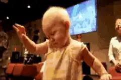 Baby dancing with hand up