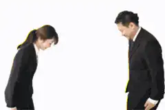 Business people bowing to each other
