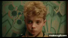 Boy in uniform with butterflies
