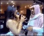 Man pulls woman's hair while she sings