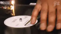 Hand spinning a CD on a table