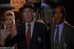 O.J. Simpson and Dan Marino walking through crowd